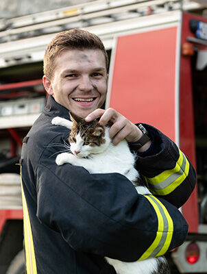 firefighter holding cat firefighter holding cat